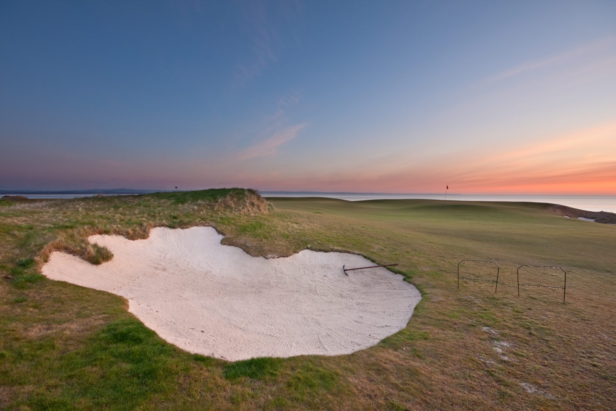 a golf bunker at sunset on the coast of Scotland